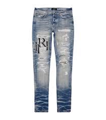 AMIRI Blue Distressed Logo Slim Jeans